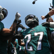 The Philadelphia Eagles, in the team’s modern midnight green uniforms